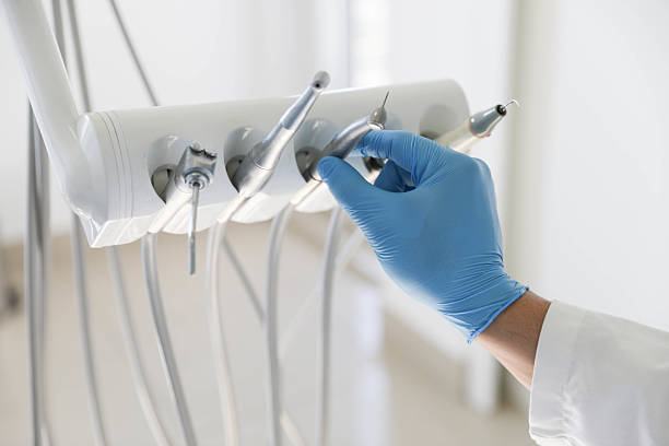 Professional Root Canal Treatment technician working in Wolf Lake, MI